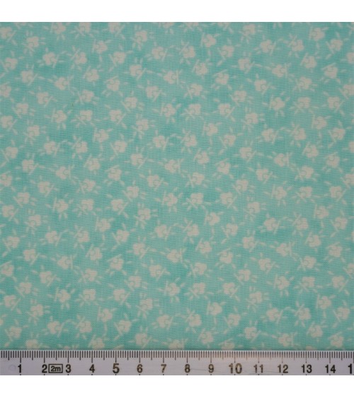 Tissu coton avec fleurs blanches sur fond bleu menthe