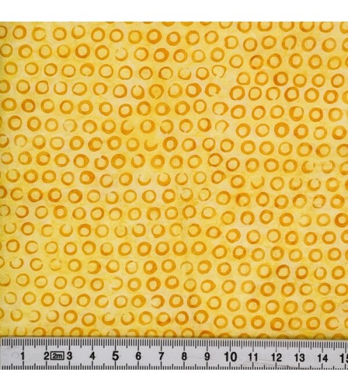Tissu batik avec pois jaunes sur fond nuancé jaune citron